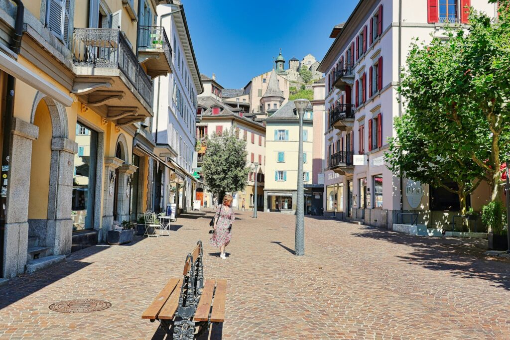 A bench sitting in the middle of a street